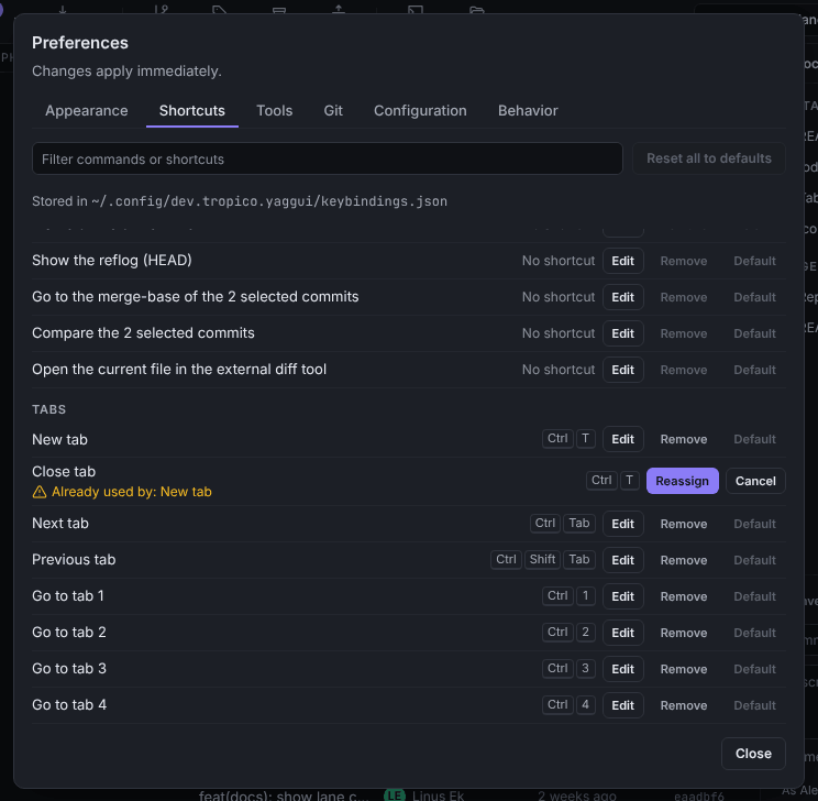 A shortcut capture showing Already used by: New tab, with the Reassign and Cancel buttons